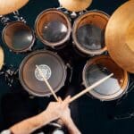 Drummer plays drum kit top view