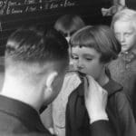 a black and white photo of a boy and a girl