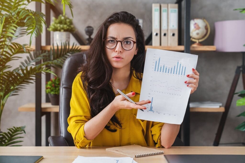 Unpleased entrepreneur woman showing bad report on videocall on laptop
