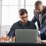 Leadership working with his employee
