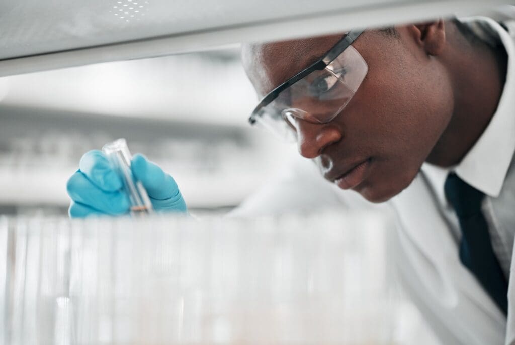 Man, test tube and science research in laboratory for medical investigation, innovation and vaccine startup challenges