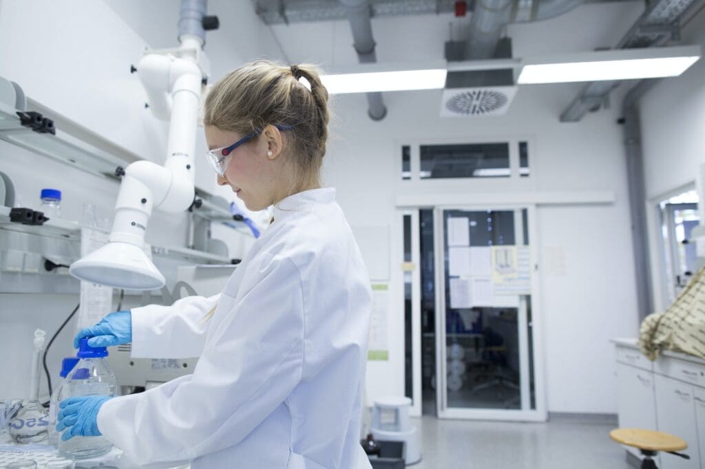 Young female scientist working in a pharmacy research laboratory