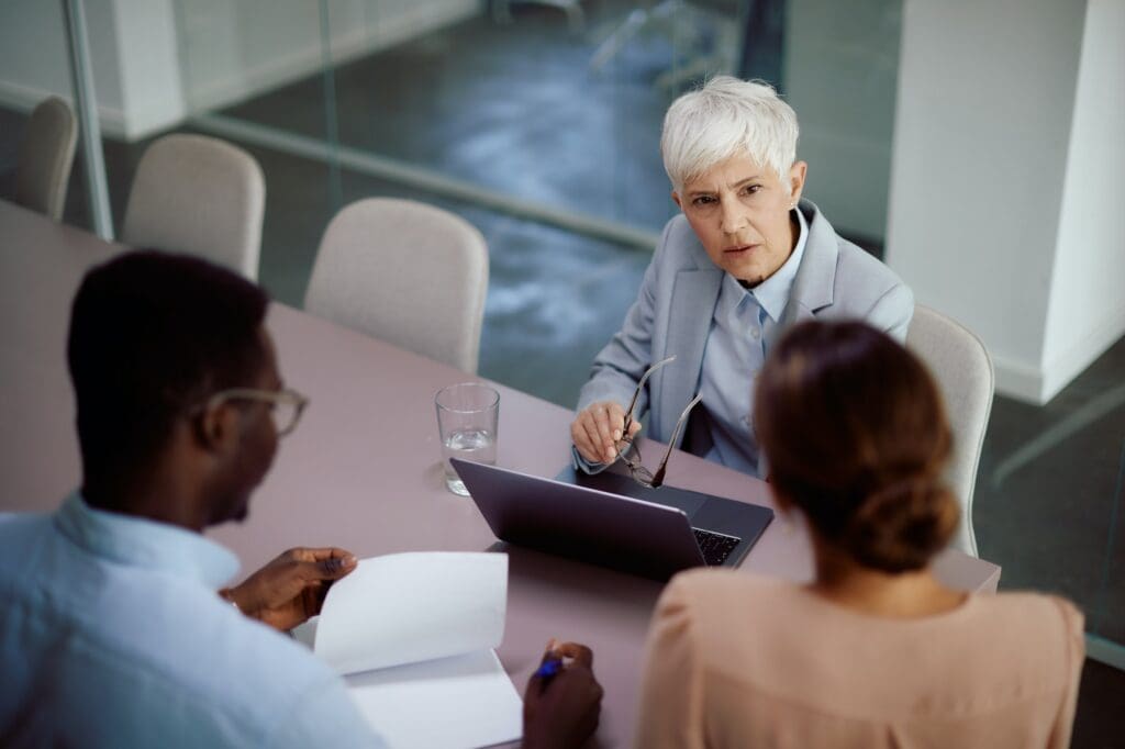 Senior female executive having business meeting with her team in the office. 505(b)(2) Pathway