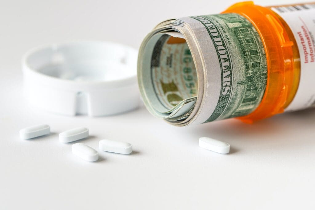 US dollar bills with medicine pills