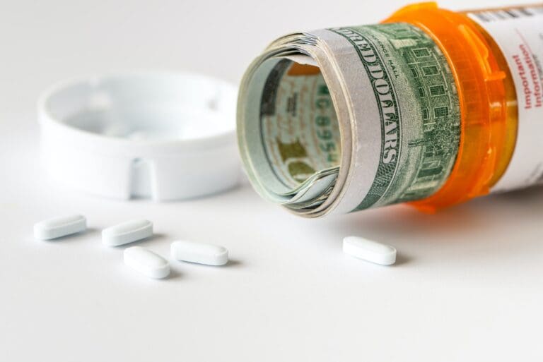 US dollar bills with medicine pills