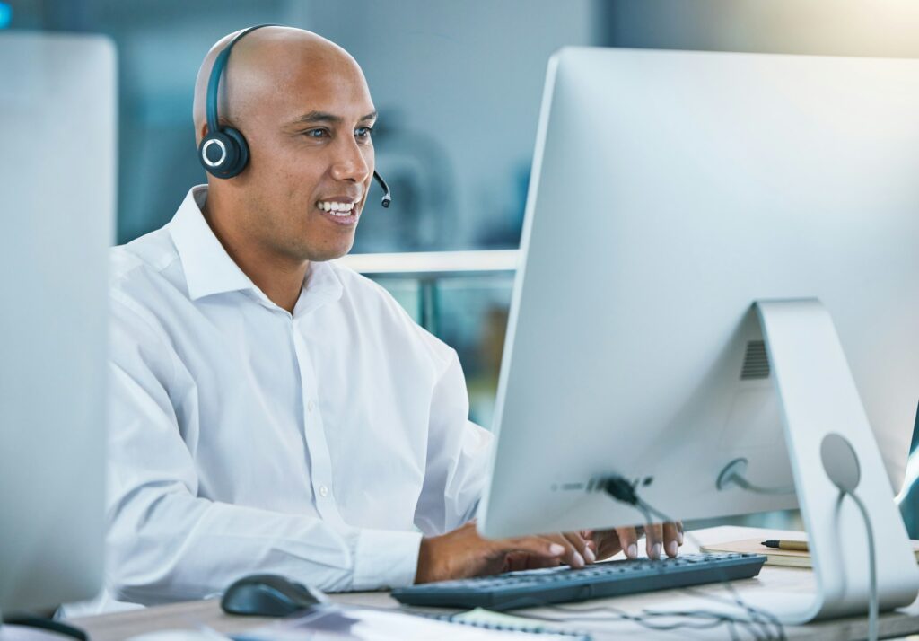 Hire a Sales Team. Professional, friendly customer service or sales consultant agency worker working with headset