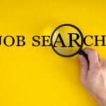 job search concept, inscription and magnifier in hand