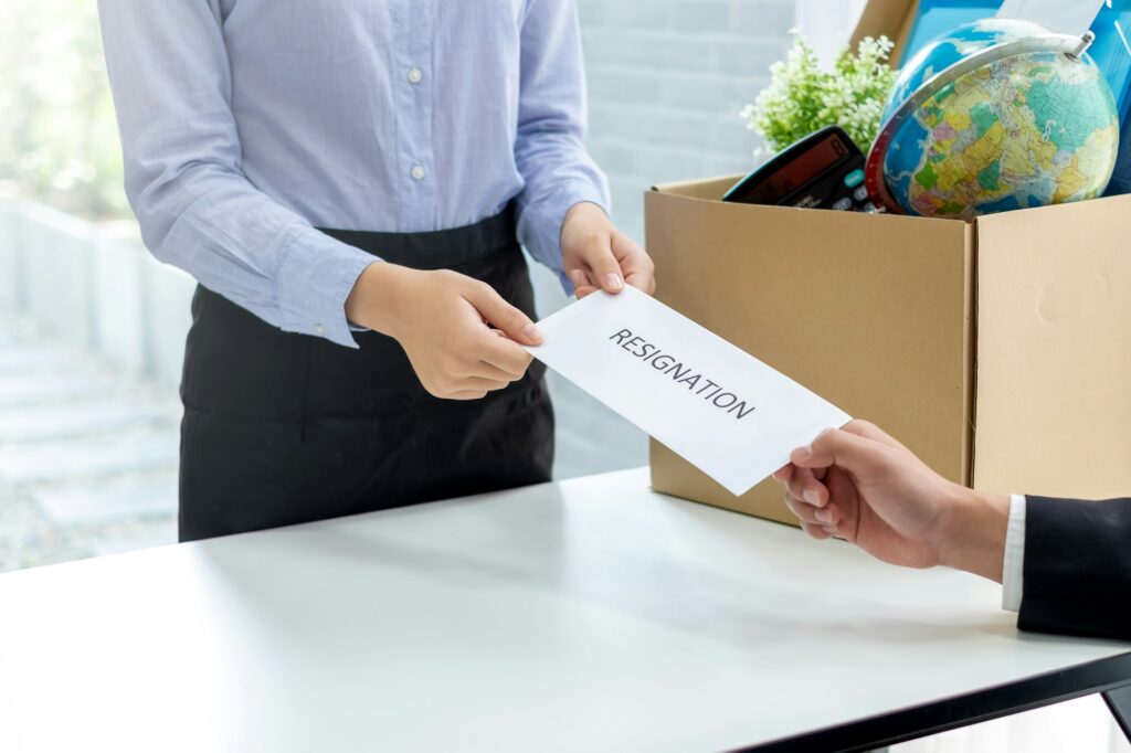 Business woman sending a resignation letter to the executive or manager.