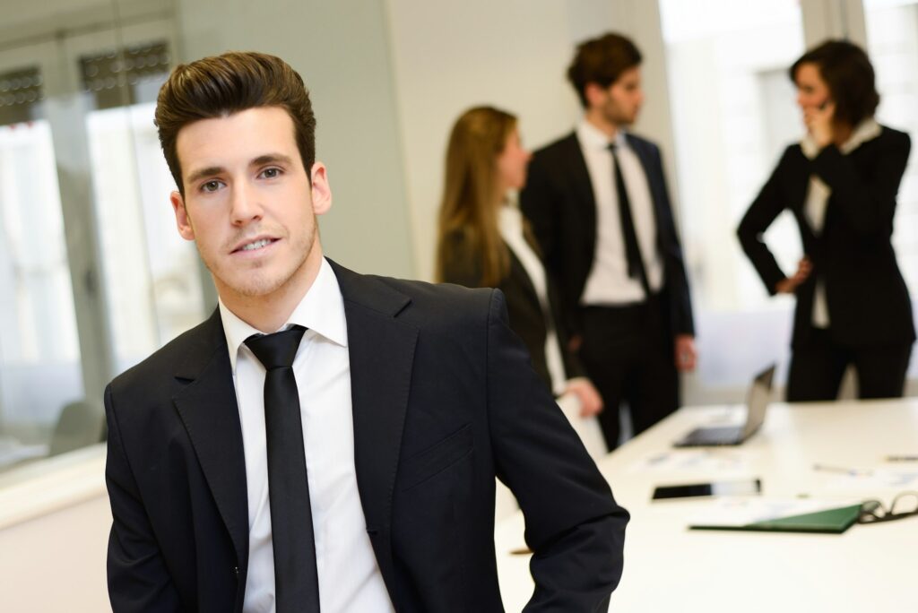 Business Administration Degree leader looking at camera in working environment