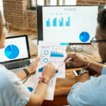 Coworkers working together with analytics