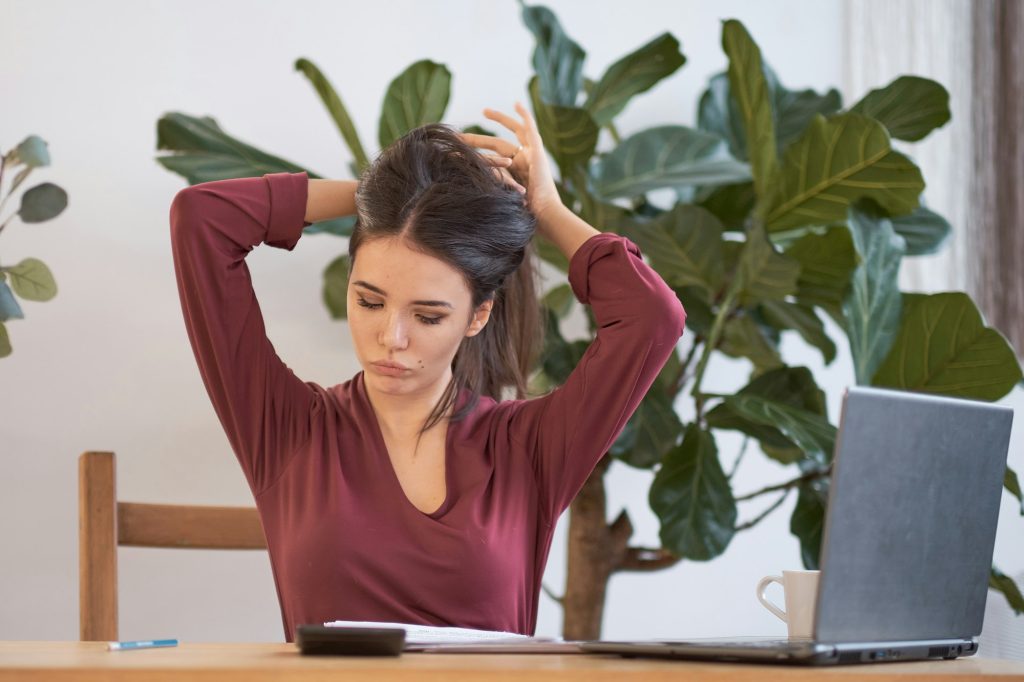 tired woman waiting for the end of the working day. concept of burnout at work. Remote worker