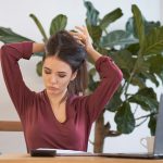 tired woman waiting for the end of the working day. concept of burnout at work. Remote worker