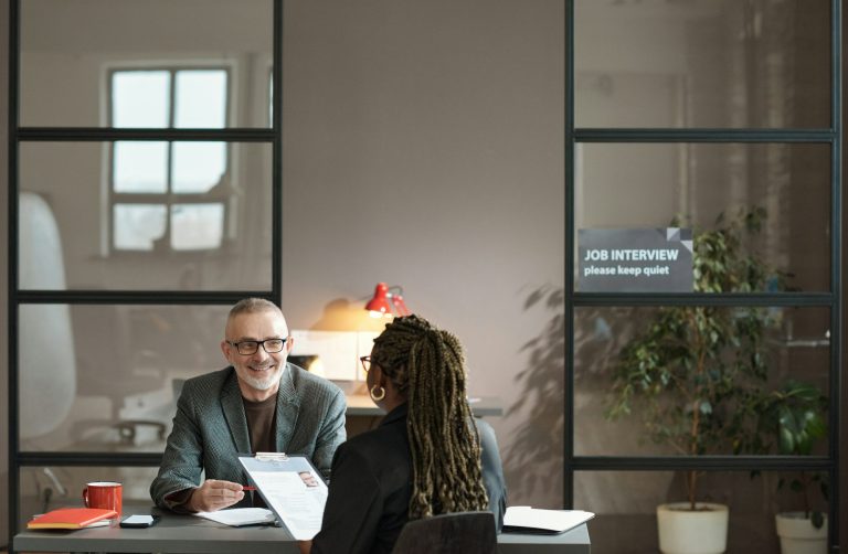Manager listening to candidate at interview