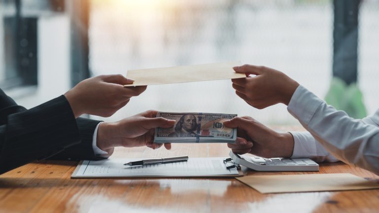 Taking money from clients to gain an advantage in a
