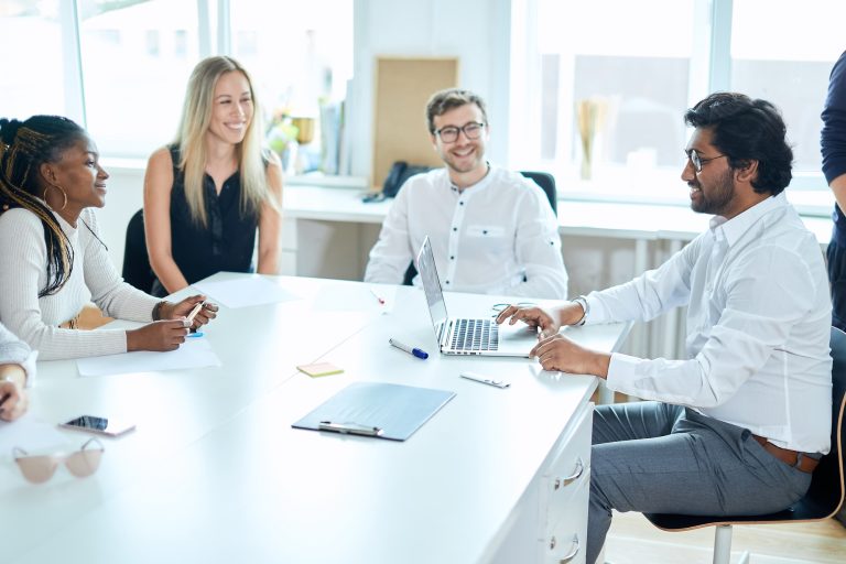 positive ambitious office workers having fun at workplace