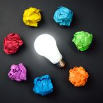 Great idea concept with crumpled colorful paper and light bulb