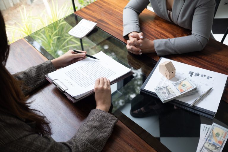 Real estate agent presenting and approved home loan contract. Real estate investment, Home mortgage
