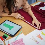 Tailor woman working in tailor shop Stylish Fashion designer tailor in workshop studio designing