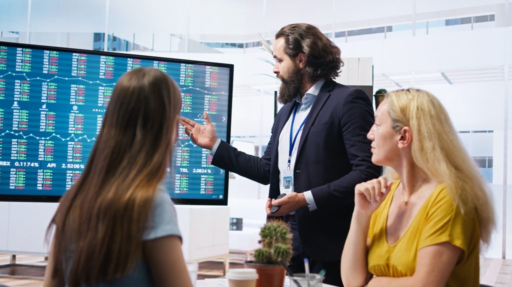 Broker in office assisting leaders with the ipo process