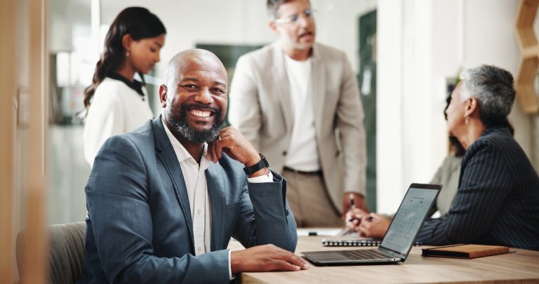 Portrait, manager and happy business man in office with laptop at venture capital. Investment, prof