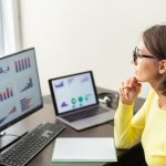 Caucasian advisor financial business analytics woman with data dashboard graphs