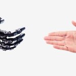 Robot hand reaches out to the human hand. Handshake of a cyborg and a man. Technology