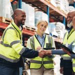 Business people, handshake and logistics with tablet for meeting in supply chain, distribution or s