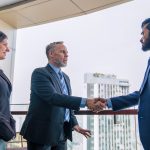 Chief executive officer with secretary meet up with business man