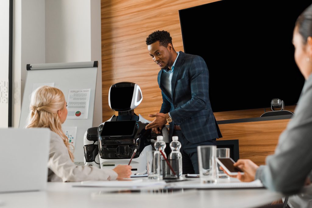 Business professionals reviewing AI hiring bias in a modern workplace
